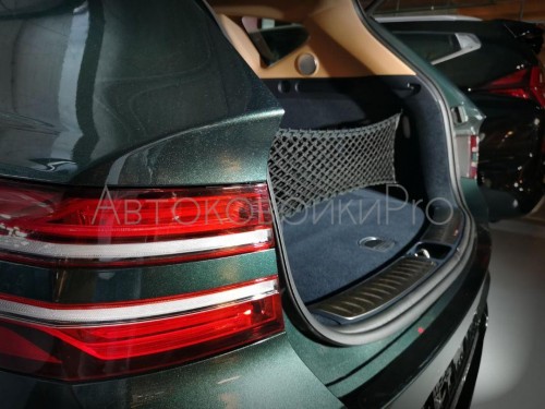 Сетка в багажник Genesis GV80 2020- Эластичная текстильная сетка вертикального крепления, препятствующая скольжению и перемещению предметов в багажном отделении автомобиля.
