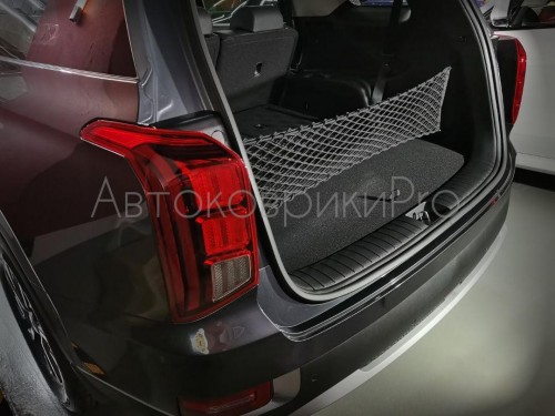 Сетка в багажник Hyundai Palisade 2019- Эластичная текстильная сетка вертикального крепления, препятствующая скольжению и перемещению предметов в багажном отделении автомобиля.