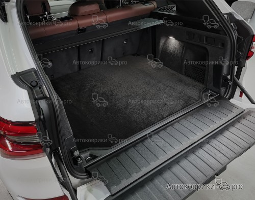 Коврик в багажник BMW X5 2018- Текстильный коврик багажника черного, серого, бежевого или коричневого цвета. Резиновая основа обеспечивает полную водонепроницаемость и защиту.